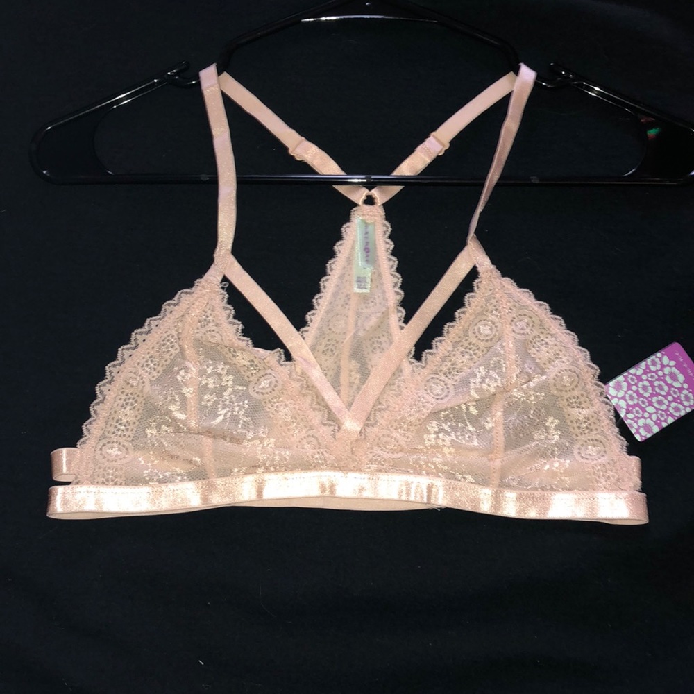nude pink lacy and strappy bralette